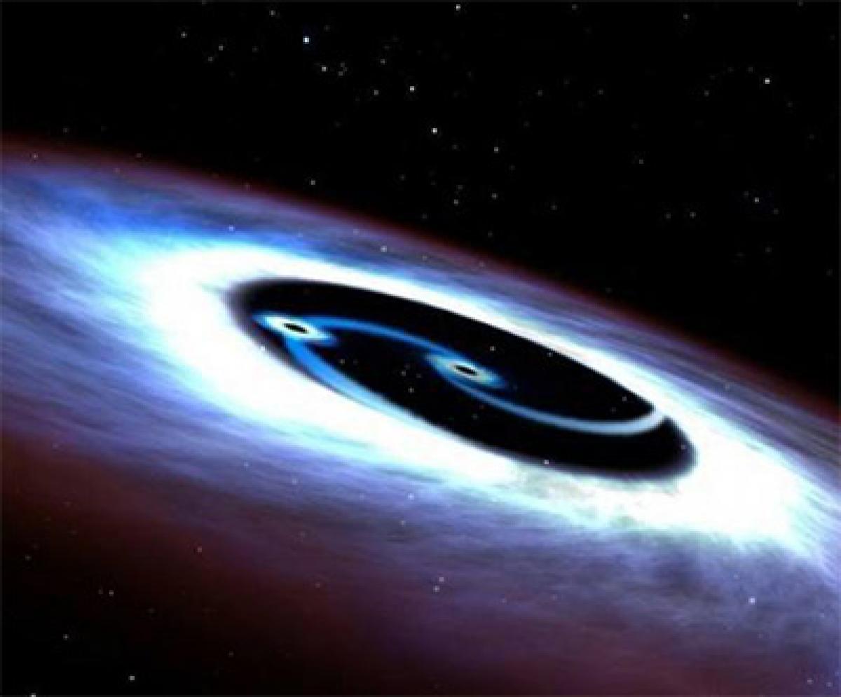 Nearest galaxy powered by two black holes: Astronomers